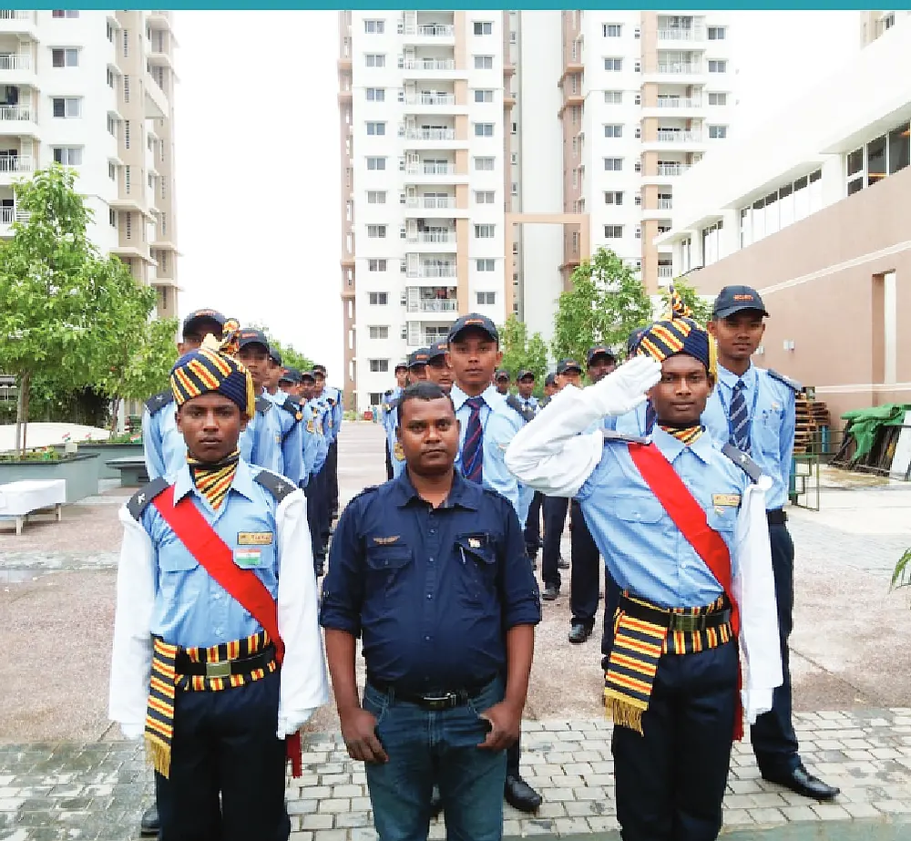 Guards on ceremonial parade with a supervisor at a gated residential community