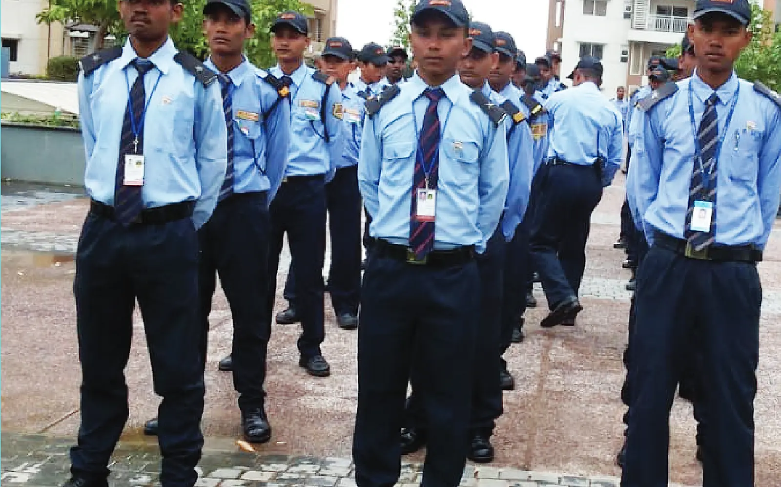 Black Commandos security guards standing in formation in uniform at a Hyderabad site