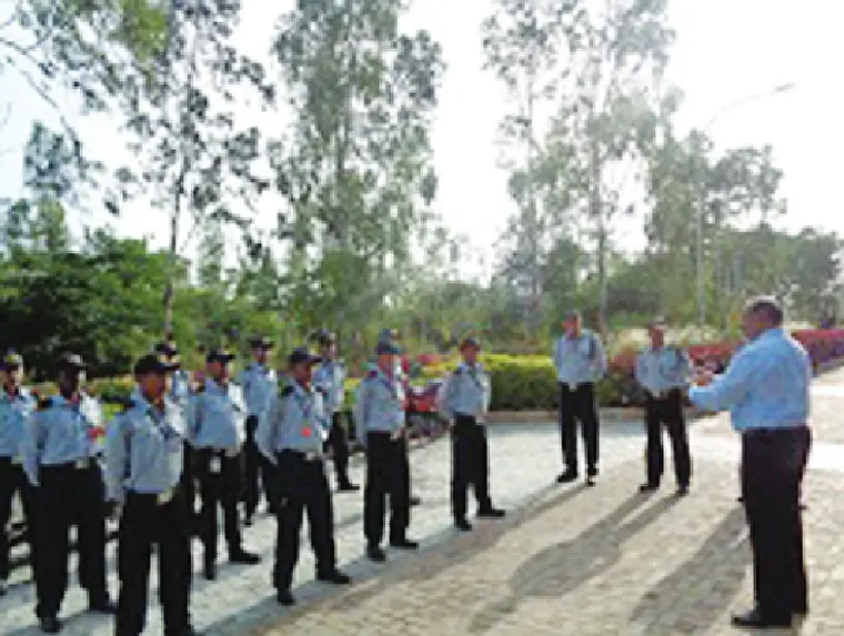 Guards receiving ground training and drill instruction from an officer